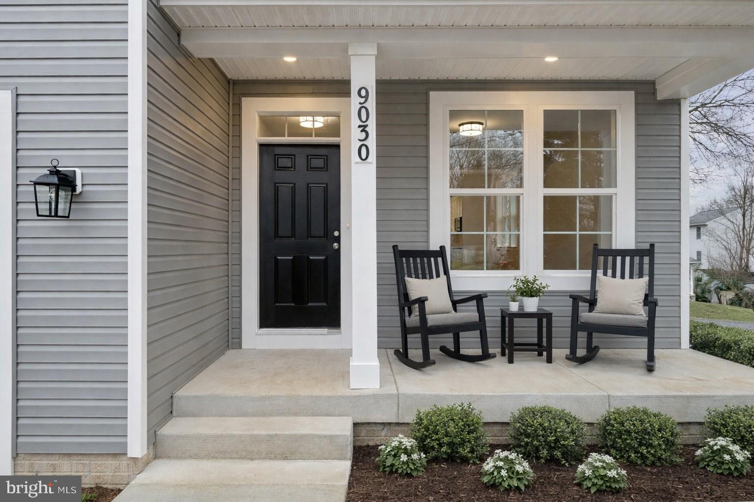 Hamilton York Road Parkton, MD 21120 - Photo 4 of 13 a front view of a house with glass windows and bench