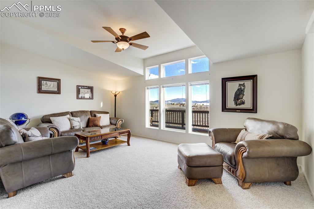 688 Tiara Road Lake George, CO 80827 - Photo 13 of 46 a living room with furniture and a large window