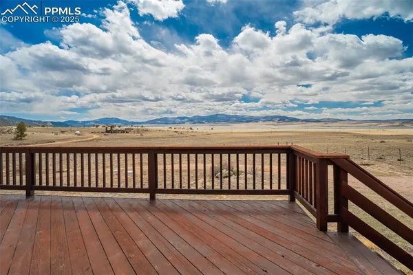 a view of outside space with wooden floor