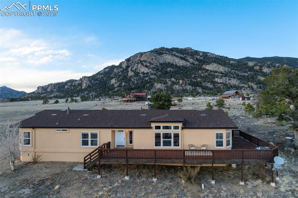 688 Tiara Road Lake George, CO 80827 - Photo 31 of 46 an aerial view of a house with a yard and mountain view