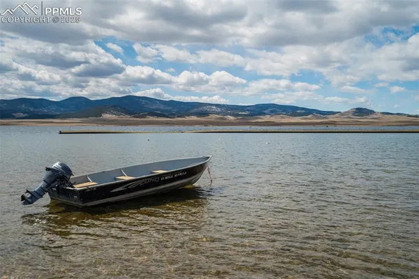 a view of a lake with mountain in the background