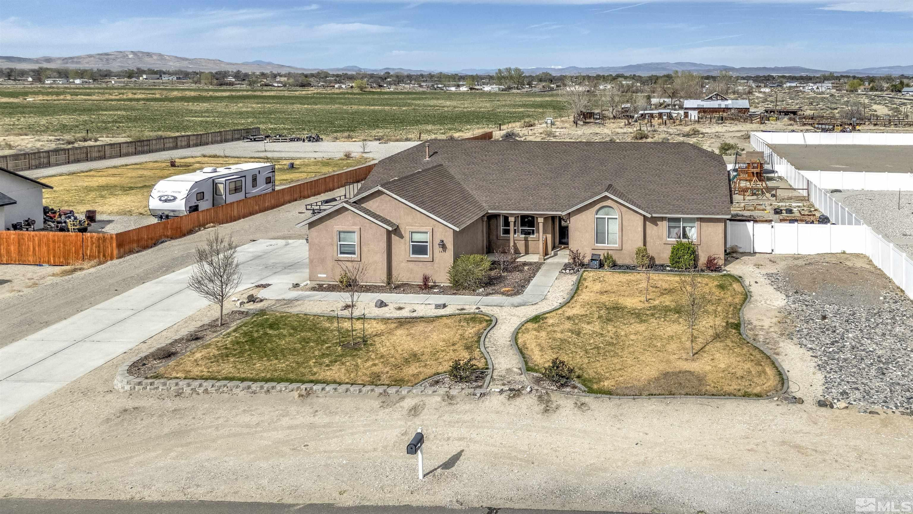 1675 Sky Ridge Drive Fallon, NV 89406 - Photo 1 of 31 a view of a terrace with a lake view