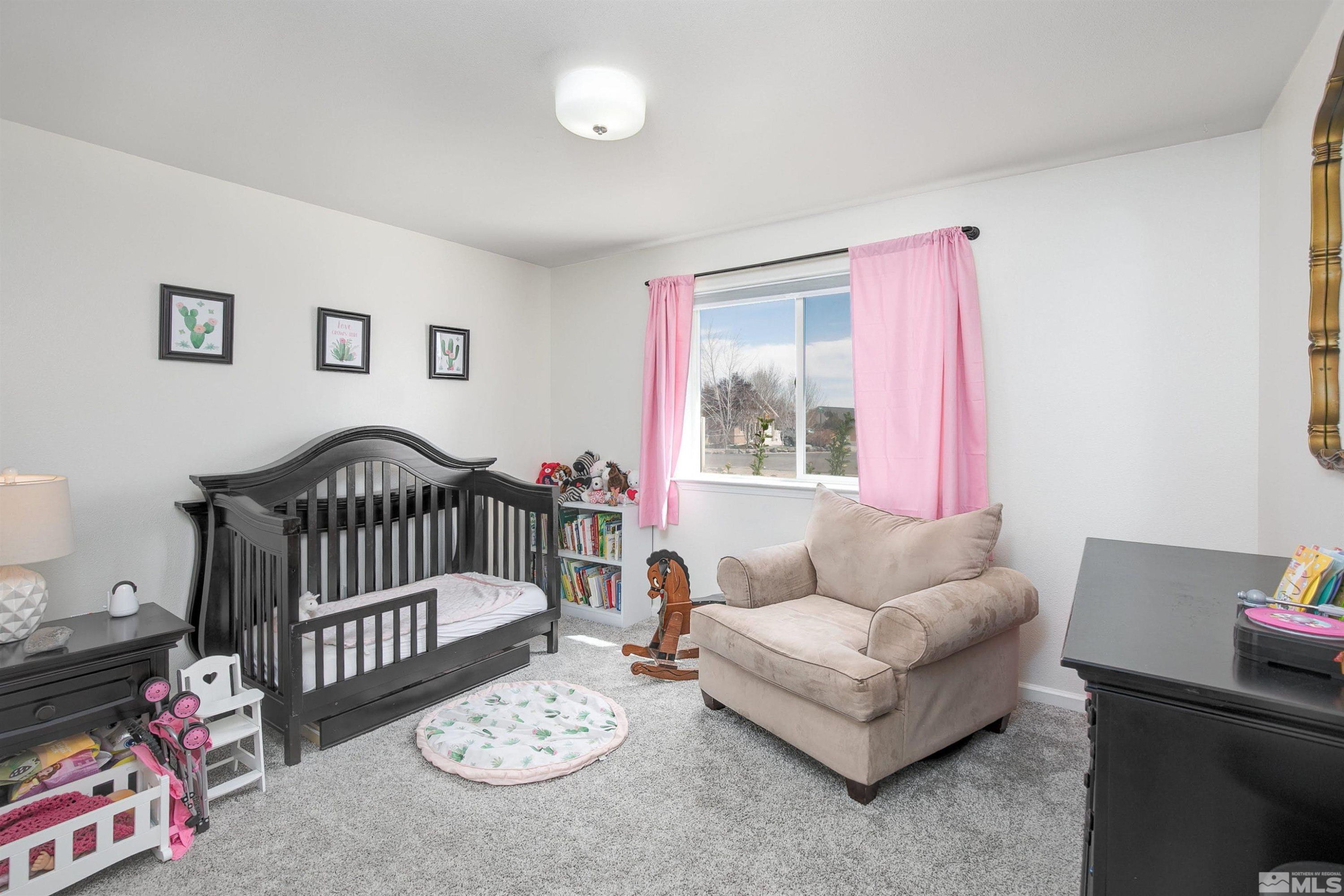 1675 Sky Ridge Drive Fallon, NV 89406 - Photo 12 of 31 a bedroom with furniture and a window
