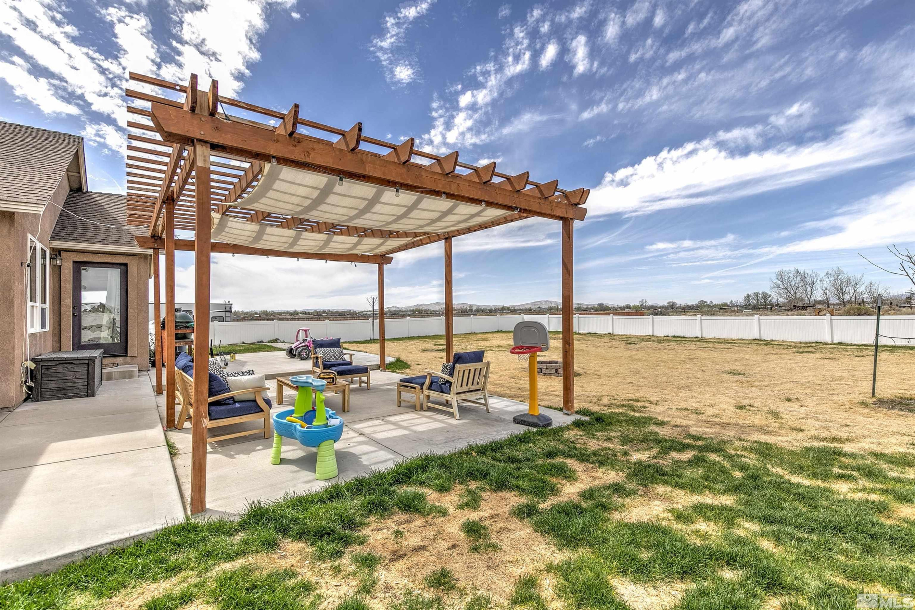 1675 Sky Ridge Drive Fallon, NV 89406 - Photo 25 of 31 a view of a swimming pool with outdoor seating