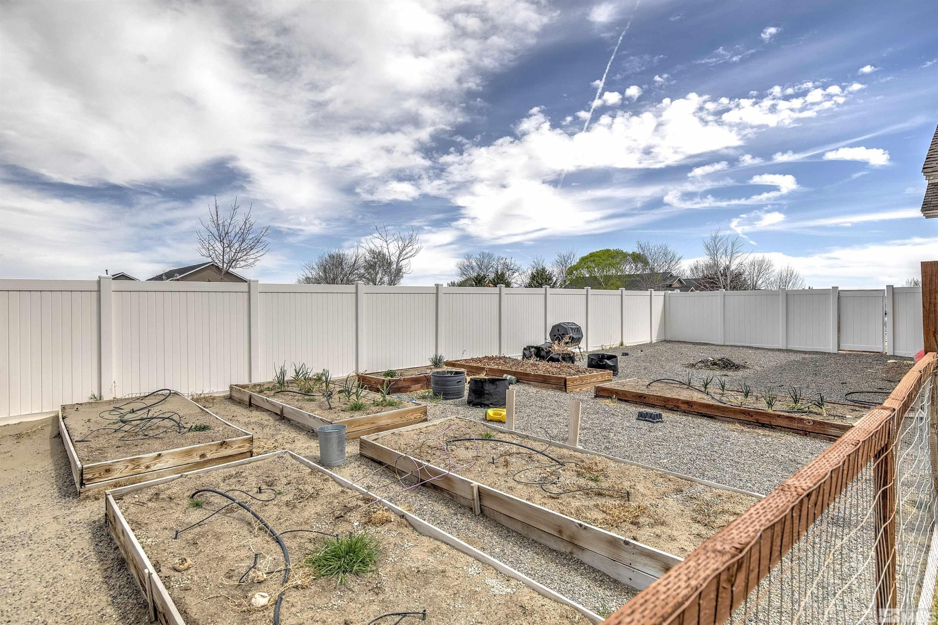 1675 Sky Ridge Drive Fallon, NV 89406 - Photo 26 of 31 a view of a backyard with sitting area