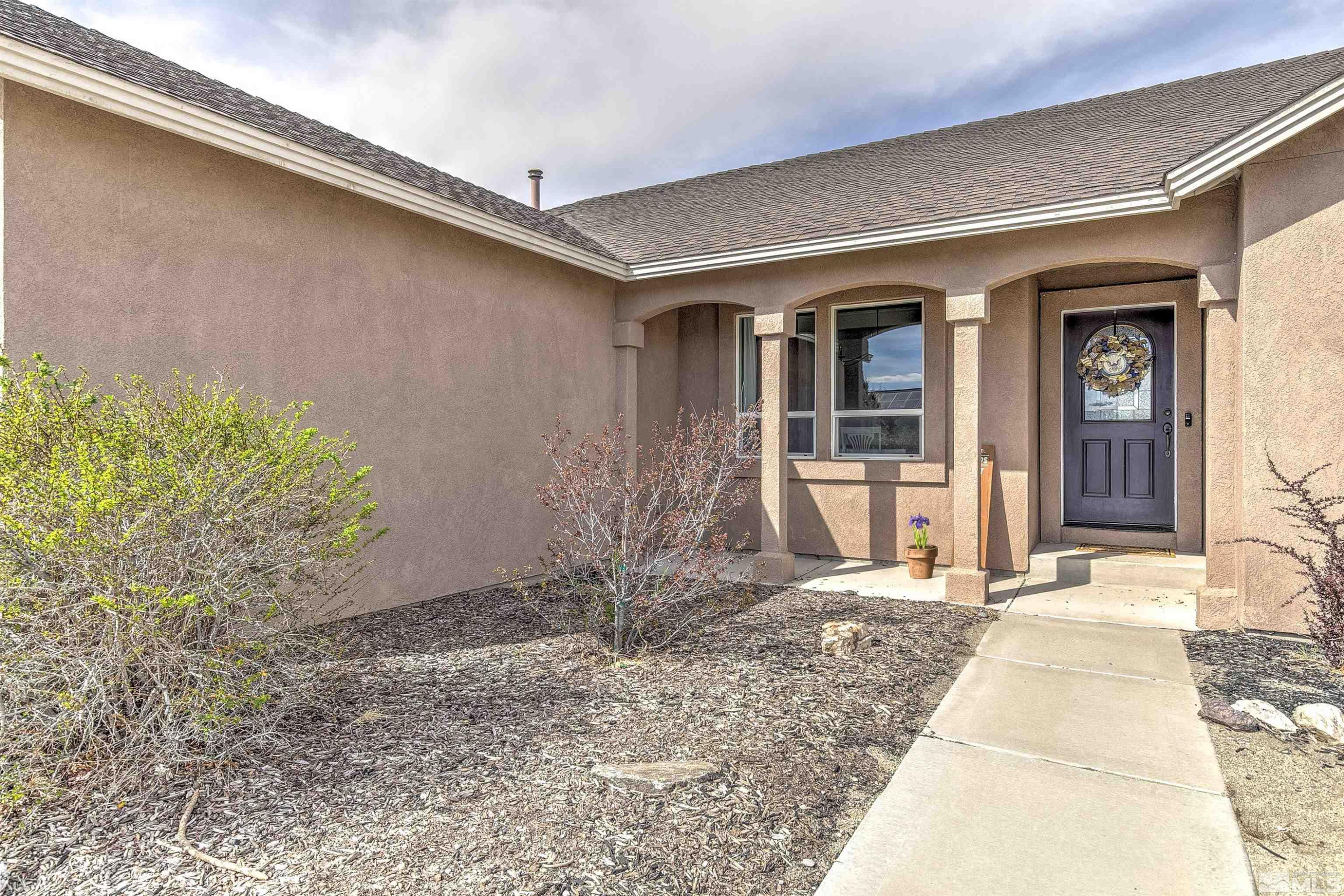 1675 Sky Ridge Drive Fallon, NV 89406 - Photo 3 of 31 a front view of a house