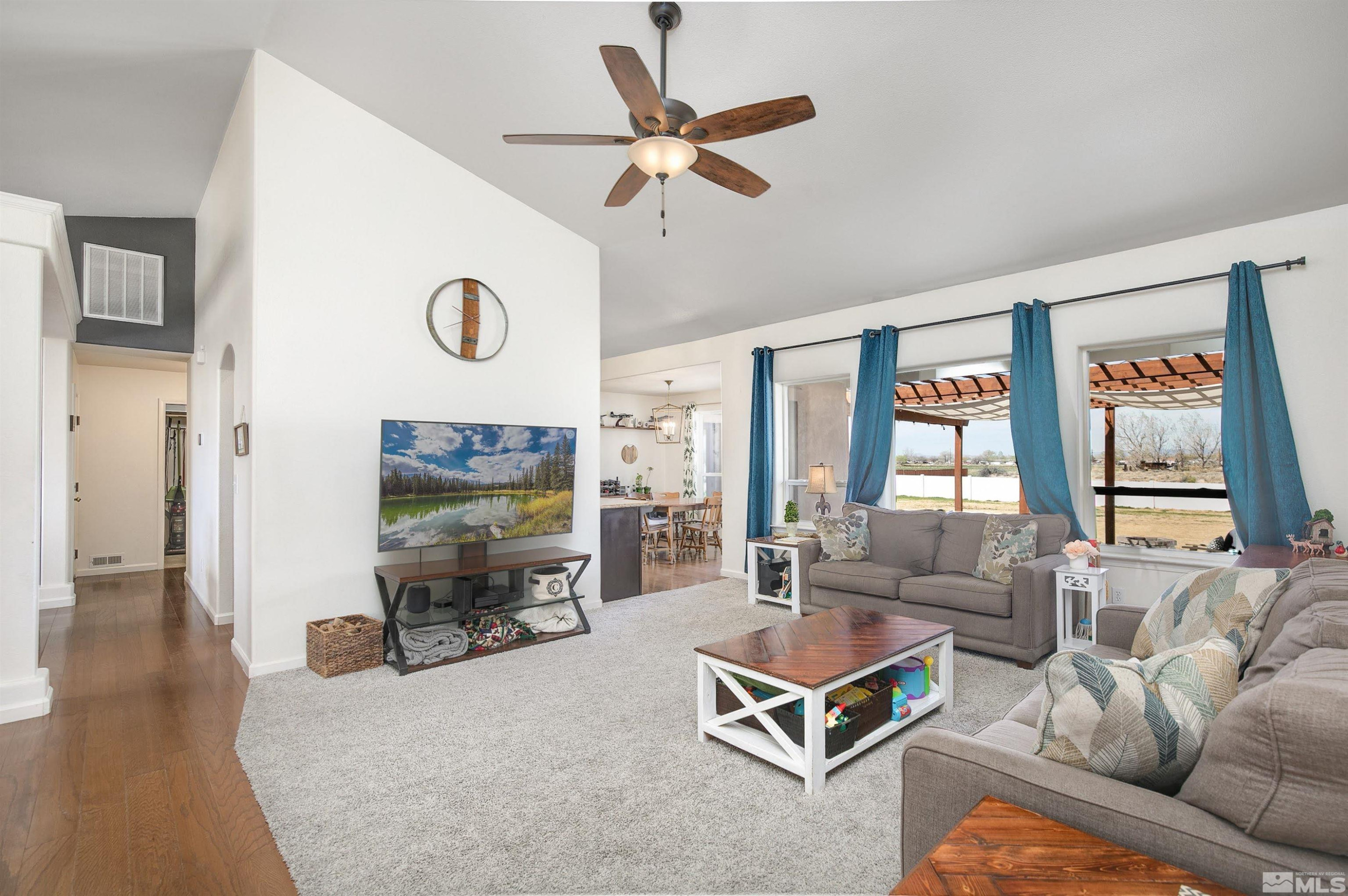 1675 Sky Ridge Drive Fallon, NV 89406 - Photo 6 of 31 a living room with furniture flat screen tv and a large window