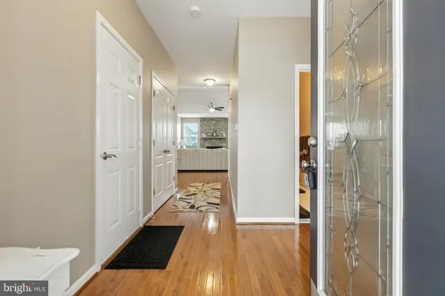 a living room with a couch a fireplace and a flat screen tv