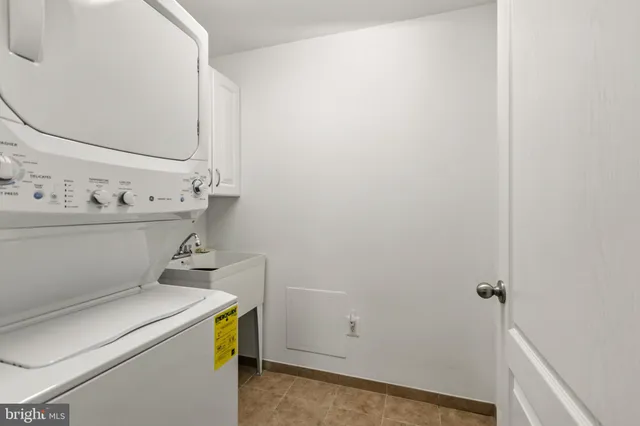 a en suite bathroom with a double vanity sink a mirror and a shower