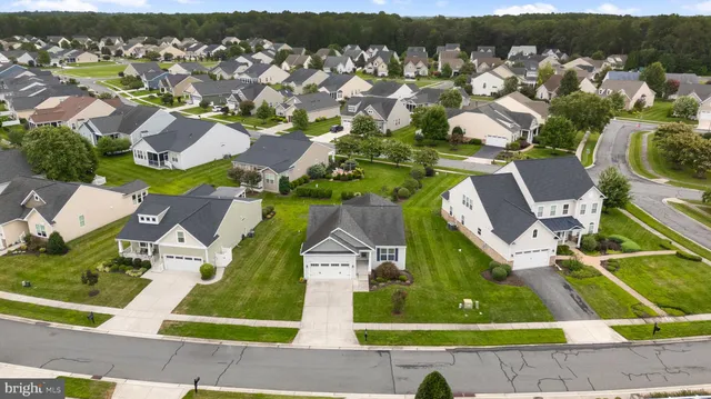 an aerial view of house with yard swimming pool and mountain view