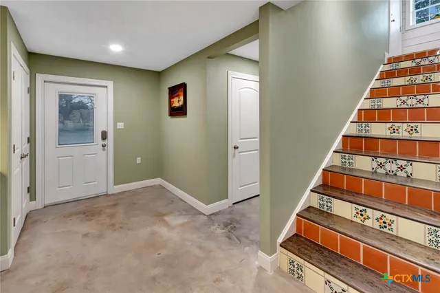 a view of a backyard with large trees