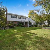a view of house with garden