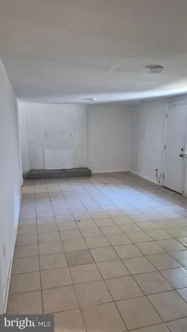 an empty room with white walls