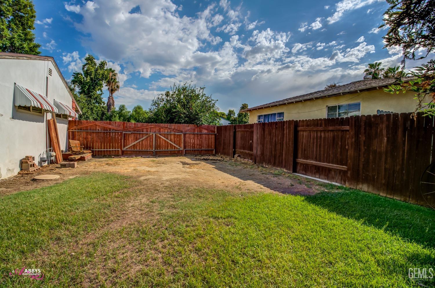 Undisclosed Address Bakersfield, CA 93309 - Photo 14 of 33 a view of backyard with seating area and green space
