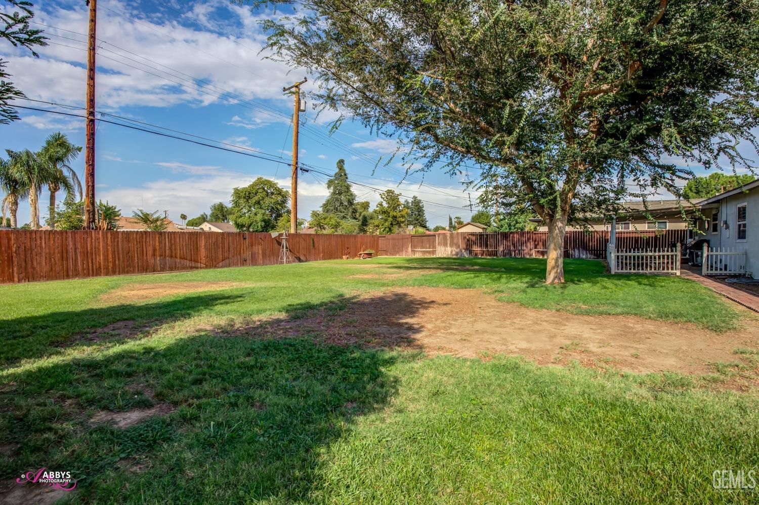 Undisclosed Address Bakersfield, CA 93309 - Photo 15 of 33 a view of a yard with a house