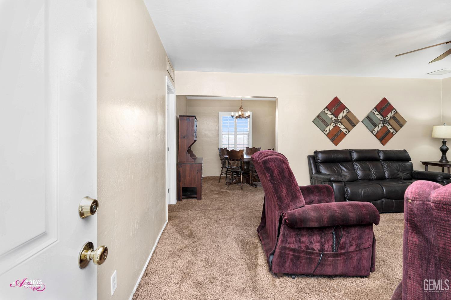 Undisclosed Address Bakersfield, CA 93309 - Photo 18 of 33 a living room with furniture and a couch