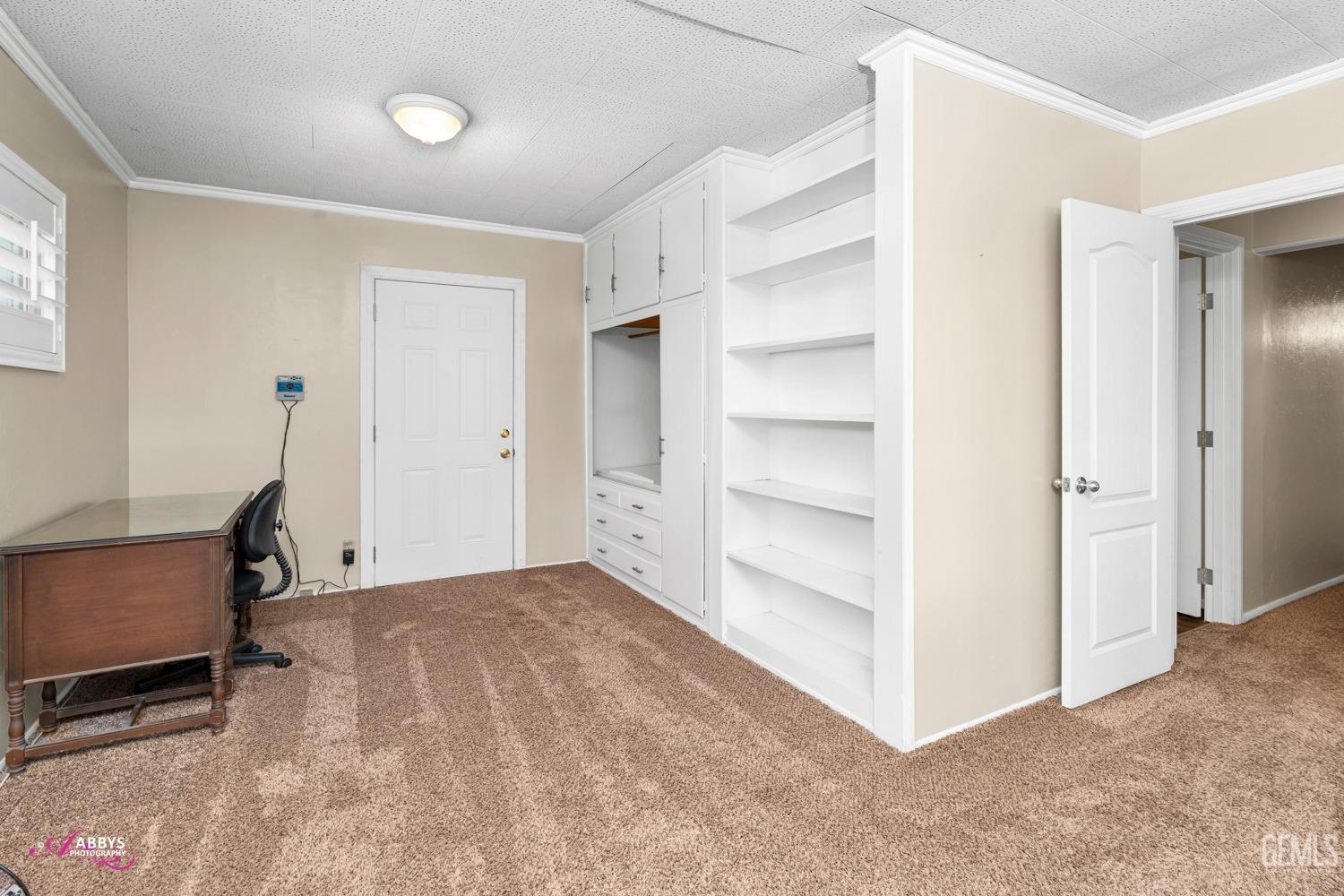 Undisclosed Address Bakersfield, CA 93309 - Photo 20 of 33 a view of room with cabinet and a window