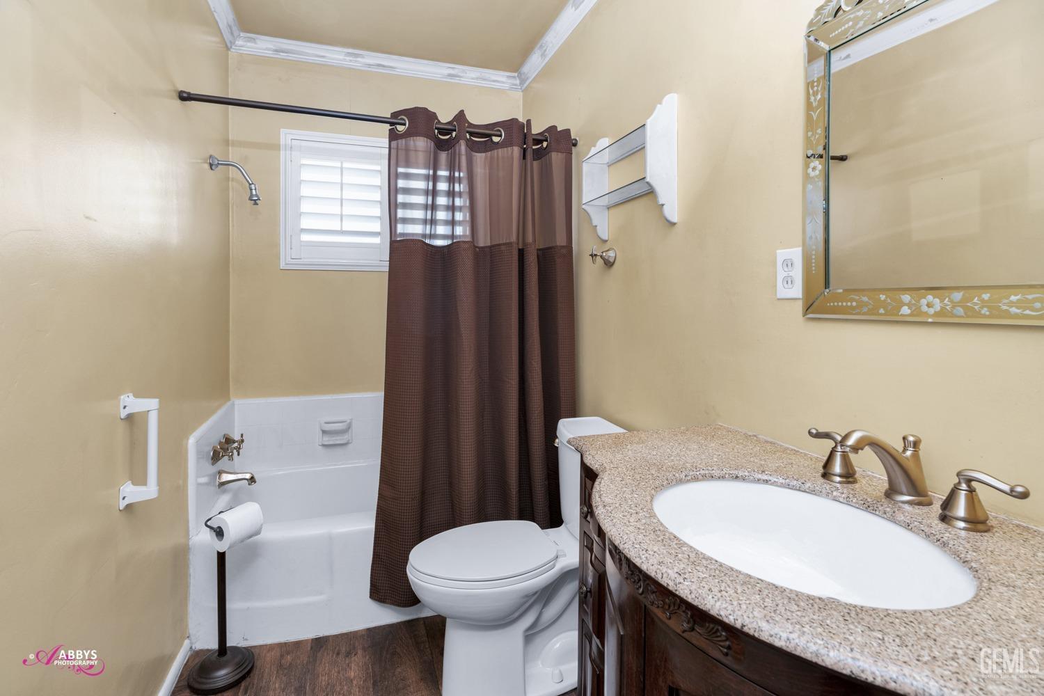 Undisclosed Address Bakersfield, CA 93309 - Photo 23 of 33 a bathroom with a granite countertop sink toilet and shower