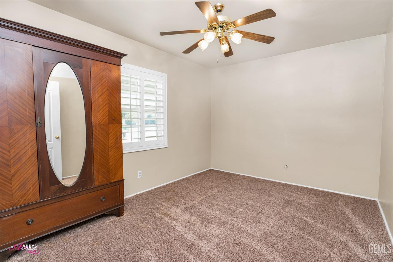 Undisclosed Address Bakersfield, CA 93309 - Photo 24 of 33 wooden floor in an empty room with a window