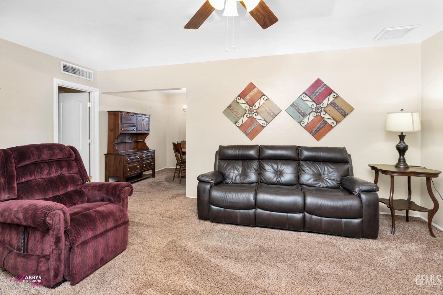 Undisclosed Address Bakersfield, CA 93309 - Photo 27 of 33 a living room with furniture