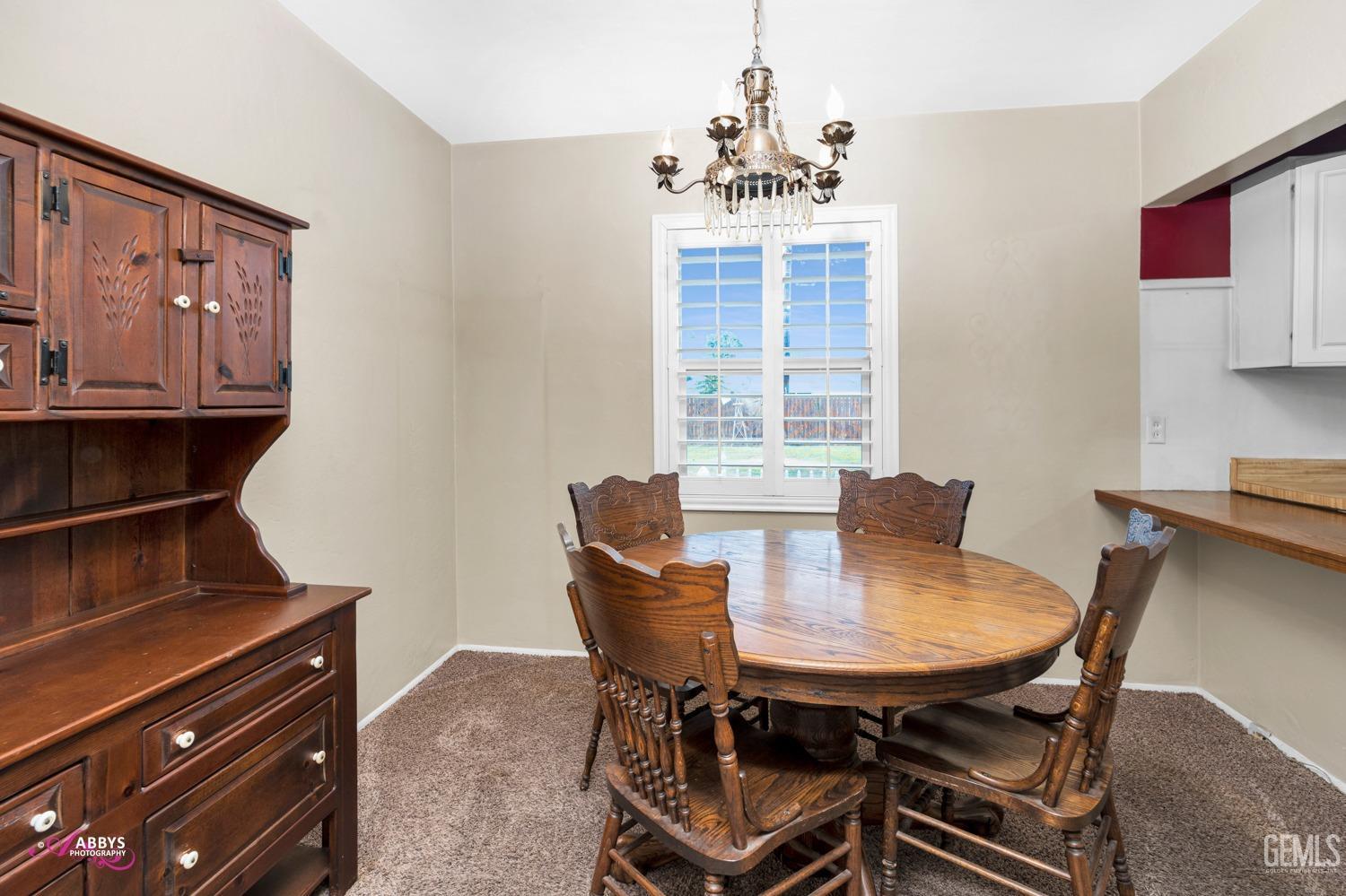 Undisclosed Address Bakersfield, CA 93309 - Photo 28 of 33 a view of a dining room with furniture and window