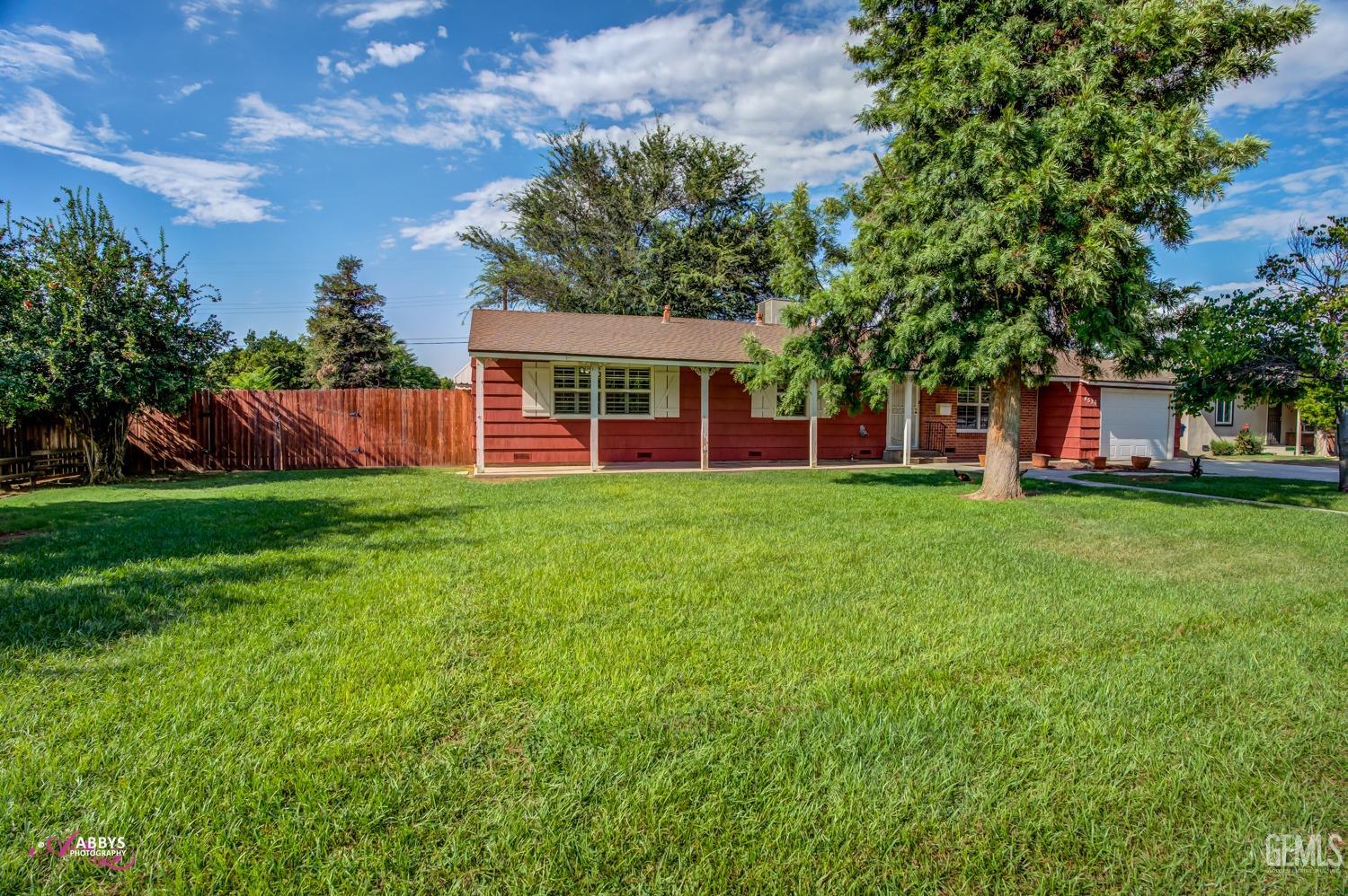 Undisclosed Address Bakersfield, CA 93309 - Photo 4 of 33 a view of a house with a yard porch and sitting area