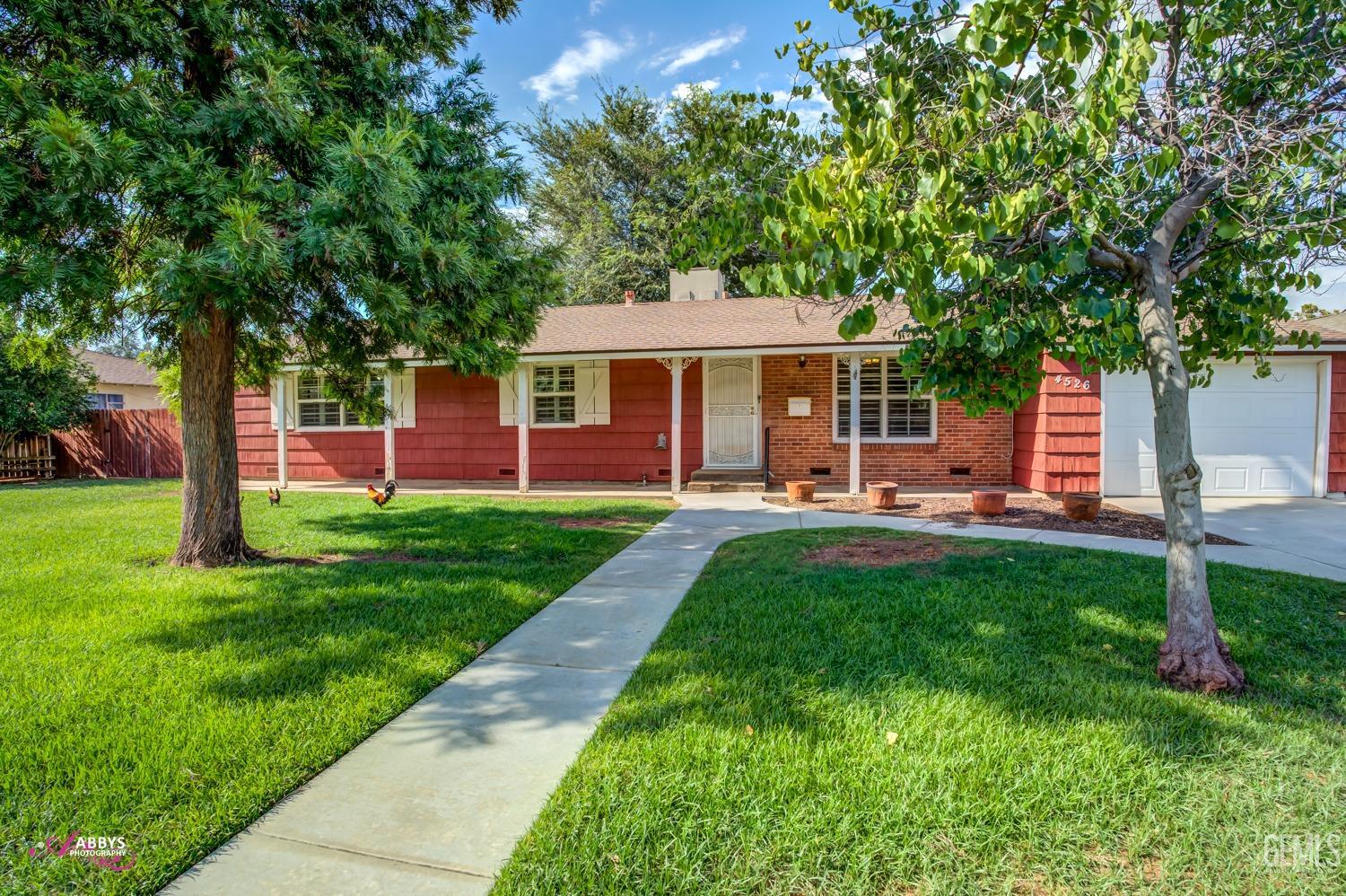 Undisclosed Address Bakersfield, CA 93309 - Photo 7 of 33 a front view of house with yard and green space