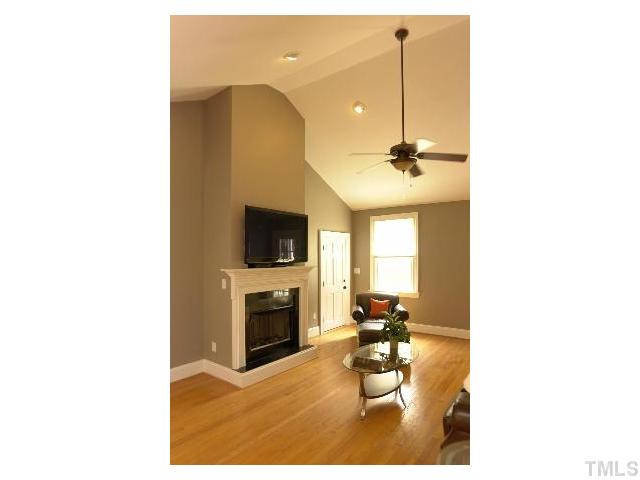 1115 Wake Forest Road, Unit D Raleigh, NC 27604 - Photo 11 of 24 a living room with furniture and a fireplace