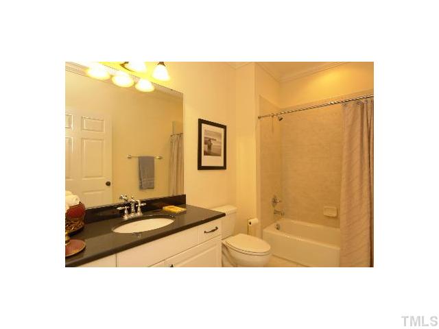 1115 Wake Forest Road, Unit D Raleigh, NC 27604 - Photo 12 of 24 a bathroom with a sink mirror and a shower