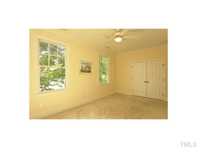 1115 Wake Forest Road, Unit D Raleigh, NC 27604 - Photo 13 of 24 a view of an empty room with windows