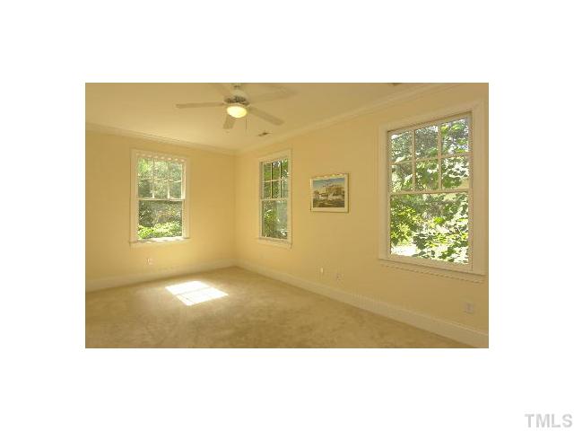 1115 Wake Forest Road, Unit D Raleigh, NC 27604 - Photo 15 of 24 a view of an empty room with windows