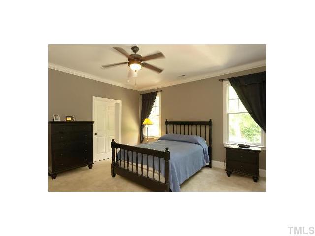 1115 Wake Forest Road, Unit D Raleigh, NC 27604 - Photo 16 of 24 a bedroom with a bed and window