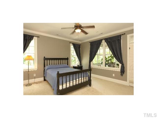 1115 Wake Forest Road, Unit D Raleigh, NC 27604 - Photo 17 of 24 a bedroom with a bed and window