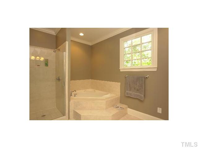 1115 Wake Forest Road, Unit D Raleigh, NC 27604 - Photo 18 of 24 a bathroom with a bathtub and a shower