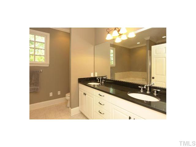 1115 Wake Forest Road, Unit D Raleigh, NC 27604 - Photo 19 of 24 a bathroom with a sink and a mirror