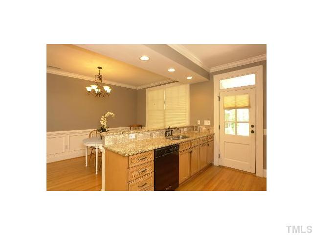 1115 Wake Forest Road, Unit D Raleigh, NC 27604 - Photo 2 of 24 a bathroom with a sink a toilet and mirror