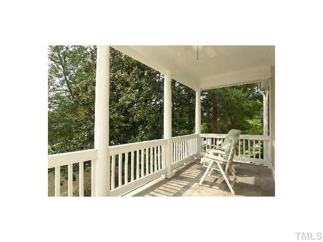 1115 Wake Forest Road, Unit D Raleigh, NC 27604 - Photo 21 of 24 a view of a chair and tables in the balcony