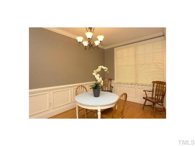 1115 Wake Forest Road, Unit D Raleigh, NC 27604 - Photo 6 of 24 a dining room with furniture and chandelier