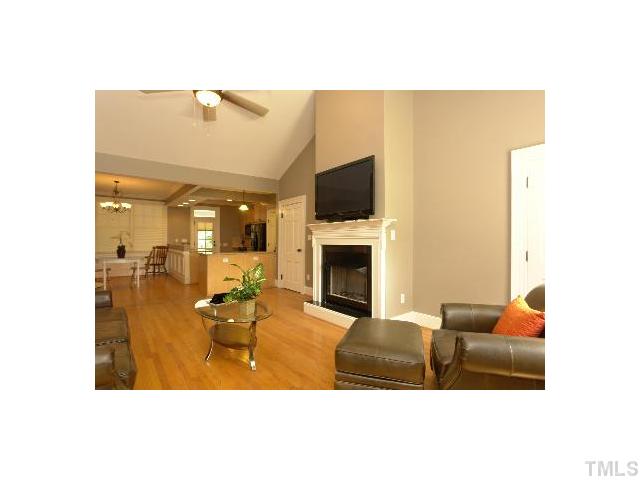 1115 Wake Forest Road, Unit D Raleigh, NC 27604 - Photo 9 of 24 a living room with furniture and a fireplace