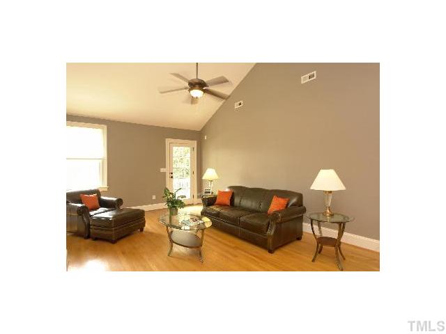 1115 Wake Forest Road, Unit D Raleigh, NC 27604 - Photo 10 of 24 a living room with furniture and a lamp