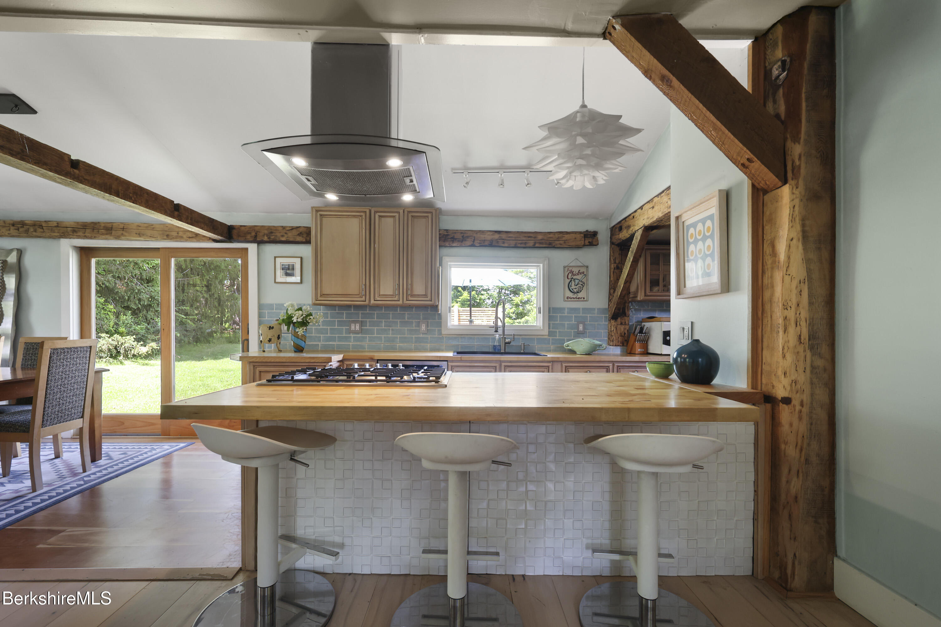 9 Castle Hill Road Stockbridge, MA 01262 - Photo 13 of 47 a view of kitchen with dining area and chandelier