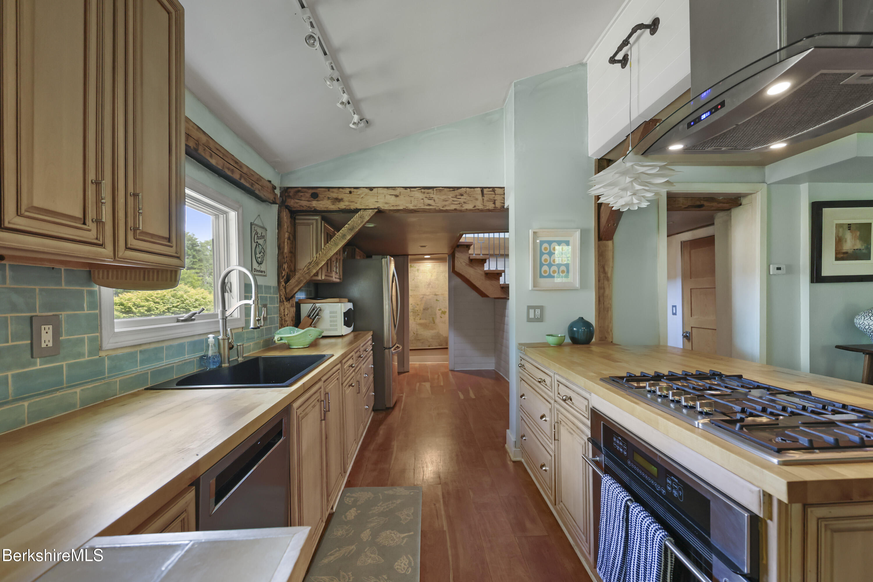 9 Castle Hill Road Stockbridge, MA 01262 - Photo 15 of 47 a kitchen with stainless steel appliances granite countertop a stove and a sink