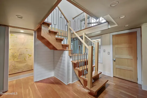 a view of entryway with wooden floor
