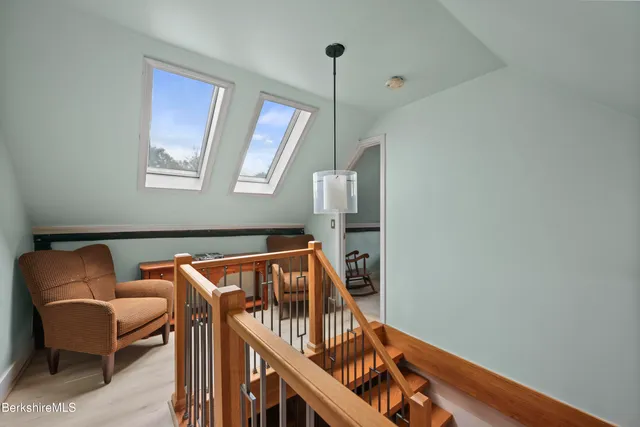 a view of staircase with furniture and stairs