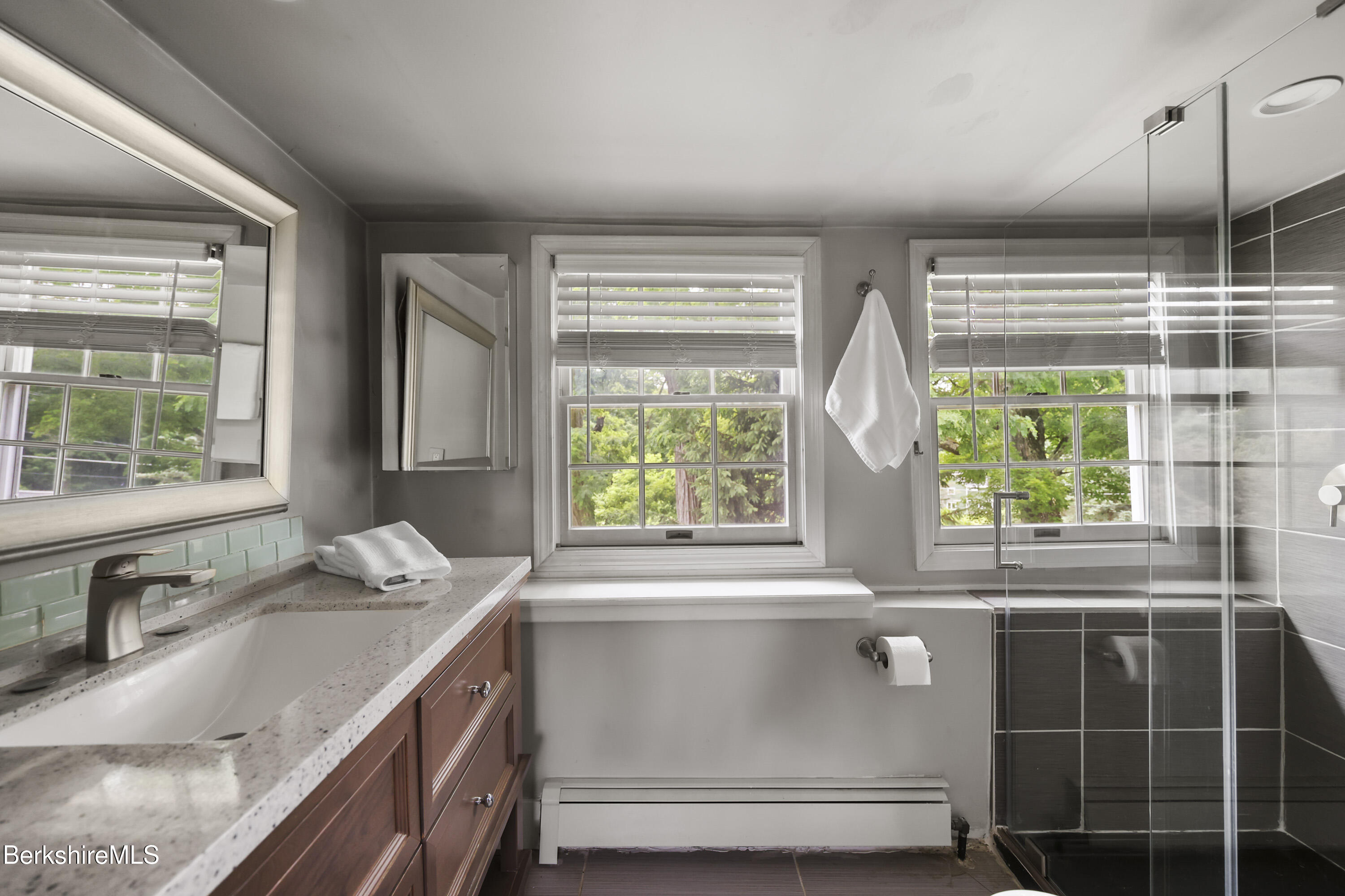 9 Castle Hill Road Stockbridge, MA 01262 - Photo 30 of 47 a bathroom with a granite countertop sink a large window and a shower