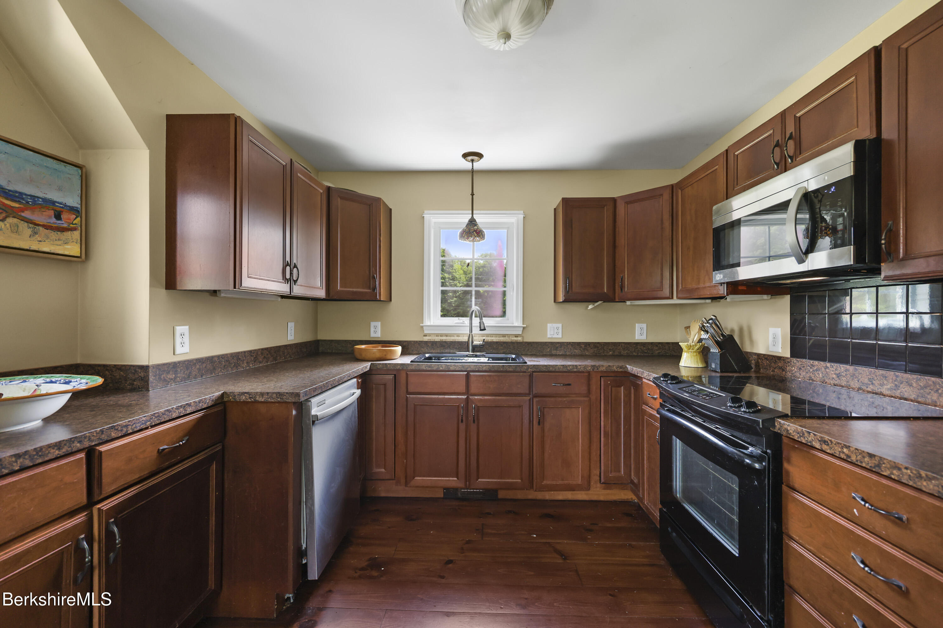 9 Castle Hill Road Stockbridge, MA 01262 - Photo 36 of 47 a kitchen with stainless steel appliances granite countertop wooden cabinets stove top oven and granite counter top