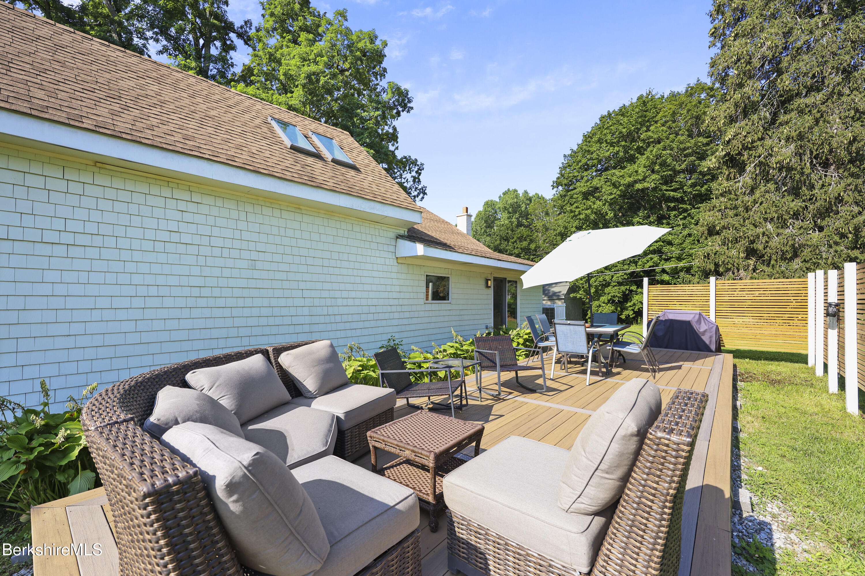 9 Castle Hill Road Stockbridge, MA 01262 - Photo 41 of 47 a view of a patio with couches chairs and a fire pit