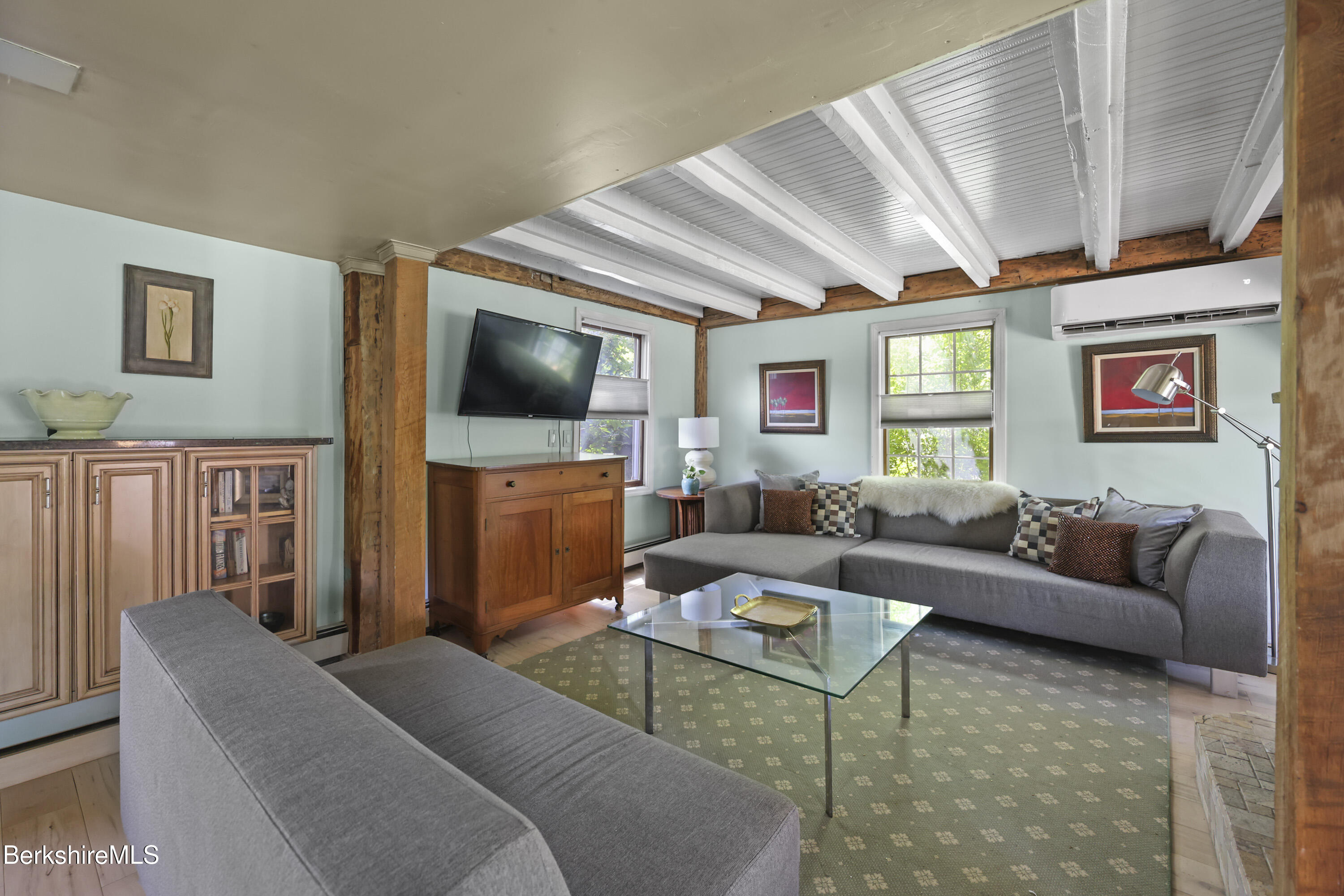 9 Castle Hill Road Stockbridge, MA 01262 - Photo 6 of 47 a living room with furniture and a flat screen tv