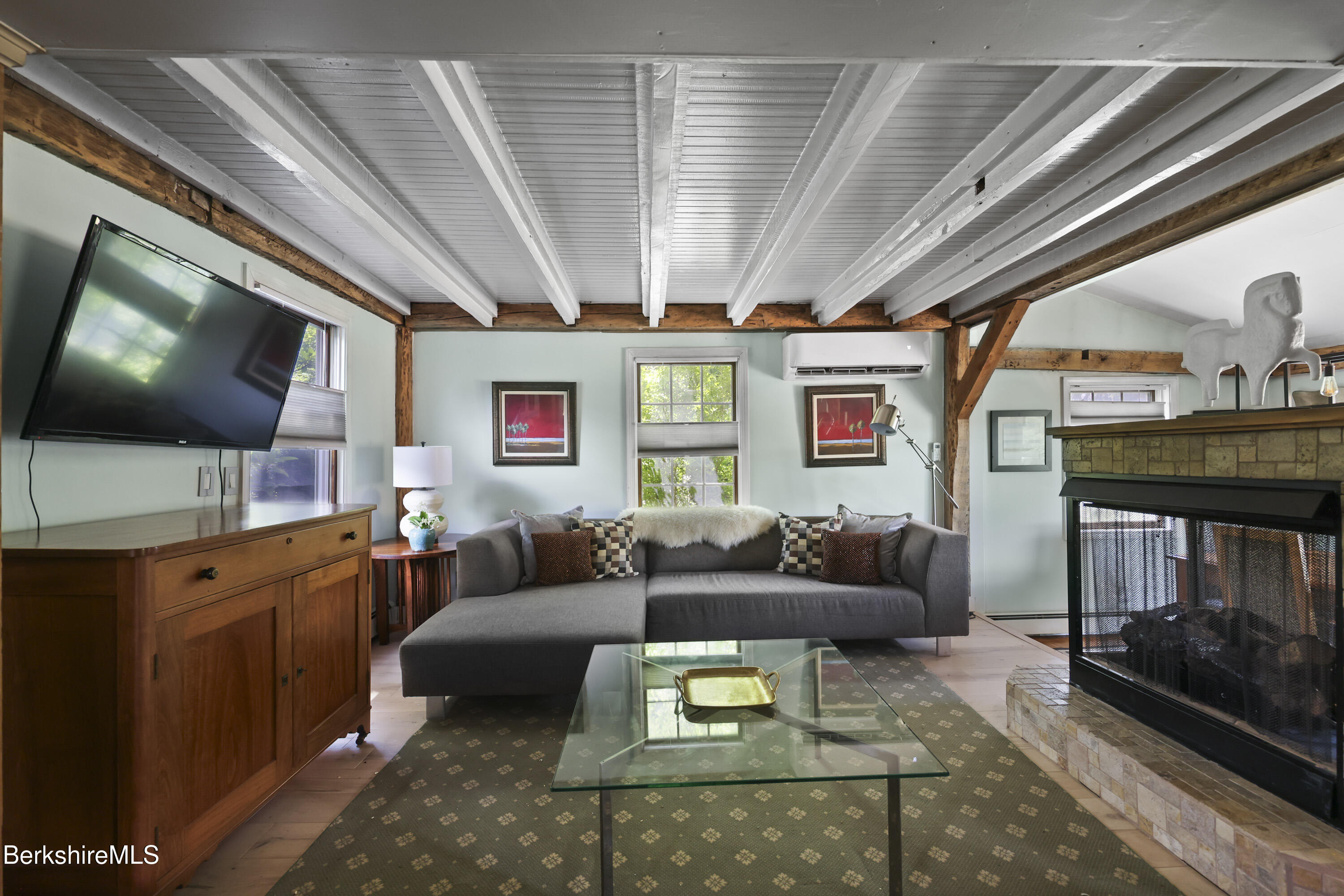 9 Castle Hill Road Stockbridge, MA 01262 - Photo 7 of 47 a living room with furniture and a flat screen tv