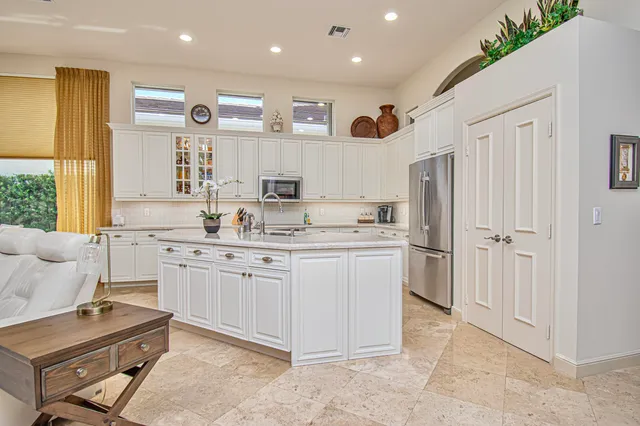 a hallway with furniture and a window